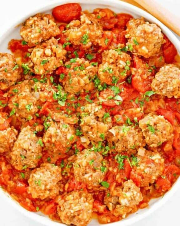 overhead view of porcupine meatballs in a bowl.