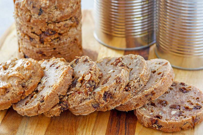 Boston brown bread slices on a cutting board.