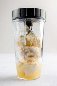 Chick Fil A frosted lemonade ingredients in a blender.
