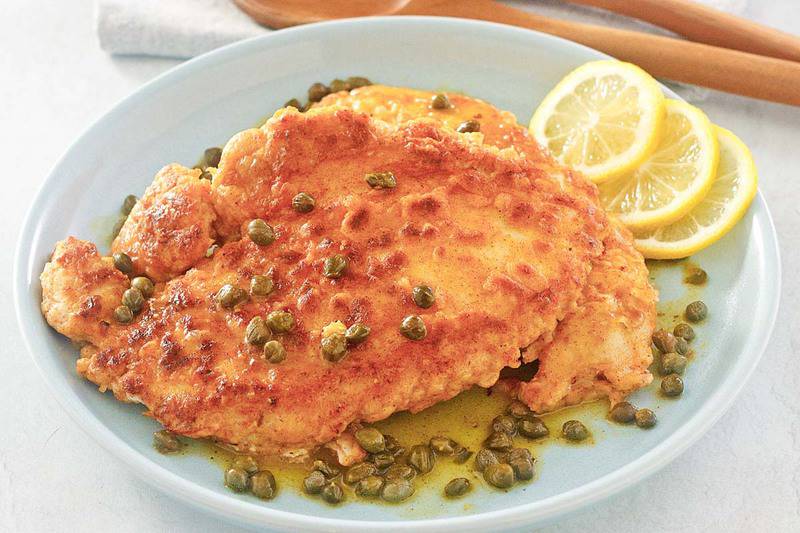 lemon chicken with capers on a plate.