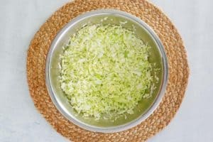 chopped cabbage and salt in a bowl.
