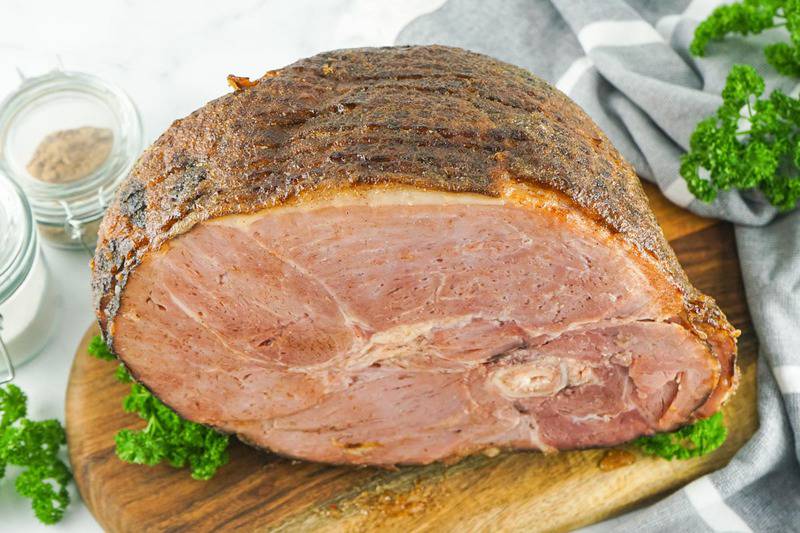 copycat Honey Baked Ham on a wood board.