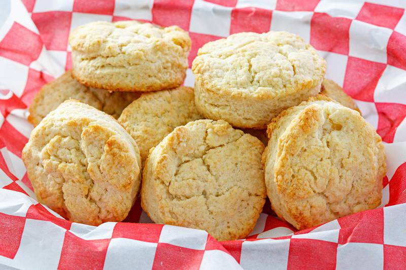 homemade KFC buttermilk biscuits on parchment paper.