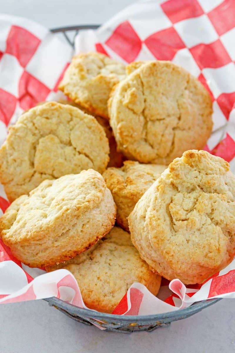 copycat KFC buttermilk biscuits in a parchment-lined basket.