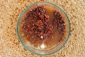 partially melted chocolate magic shell ingredients in a bowl.