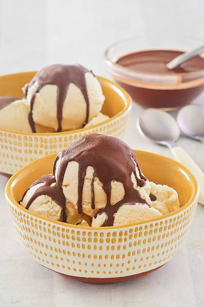 homemade chocolate magic shell on vanilla ice cream and in a bowl.