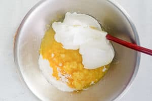 mandarin orange cake frosting ingredients in a bowl.
