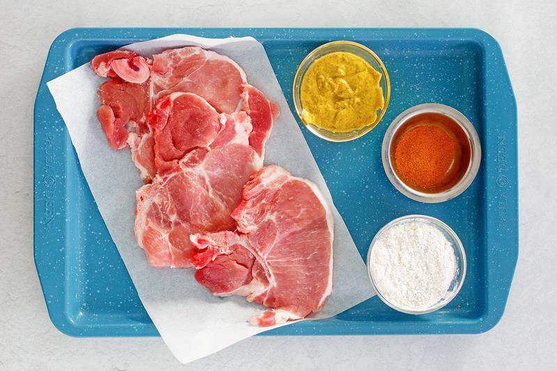 mustard pork chops ingredients on a tray.