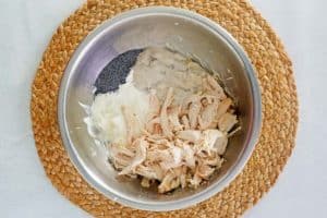 poppy seed chicken ingredients in a bowl.