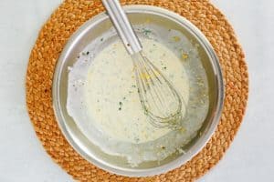 lemon caper sauce in a mixing bowl.