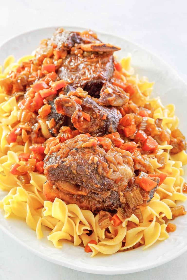 braised short ribs and noodles on a platter.