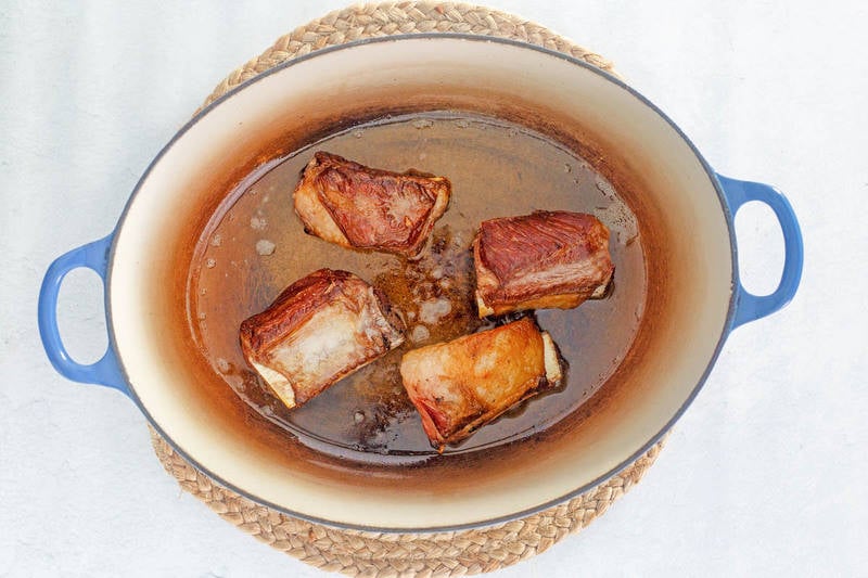 browned short ribs in a Dutch oven.