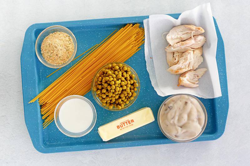 chicken tetrazzini ingredients on a tray.