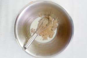 cream of mushroom soup and milk in a bowl.