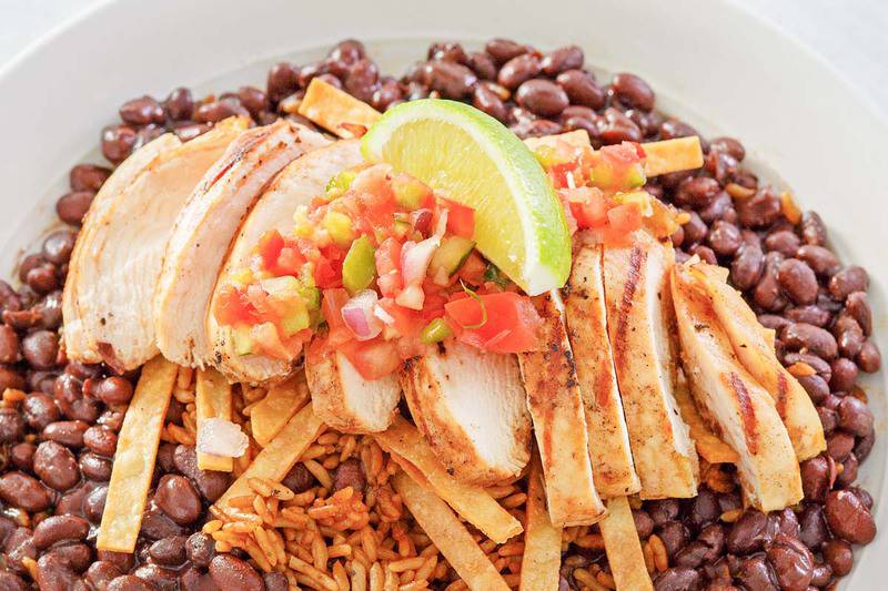 copycat Chili's margarita grilled chicken over Mexican rice and black beans.