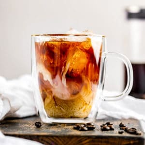 a cup of cold brew coffee with cream.