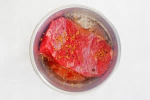 corned beef, seasoning, and liquid in an instant pot.