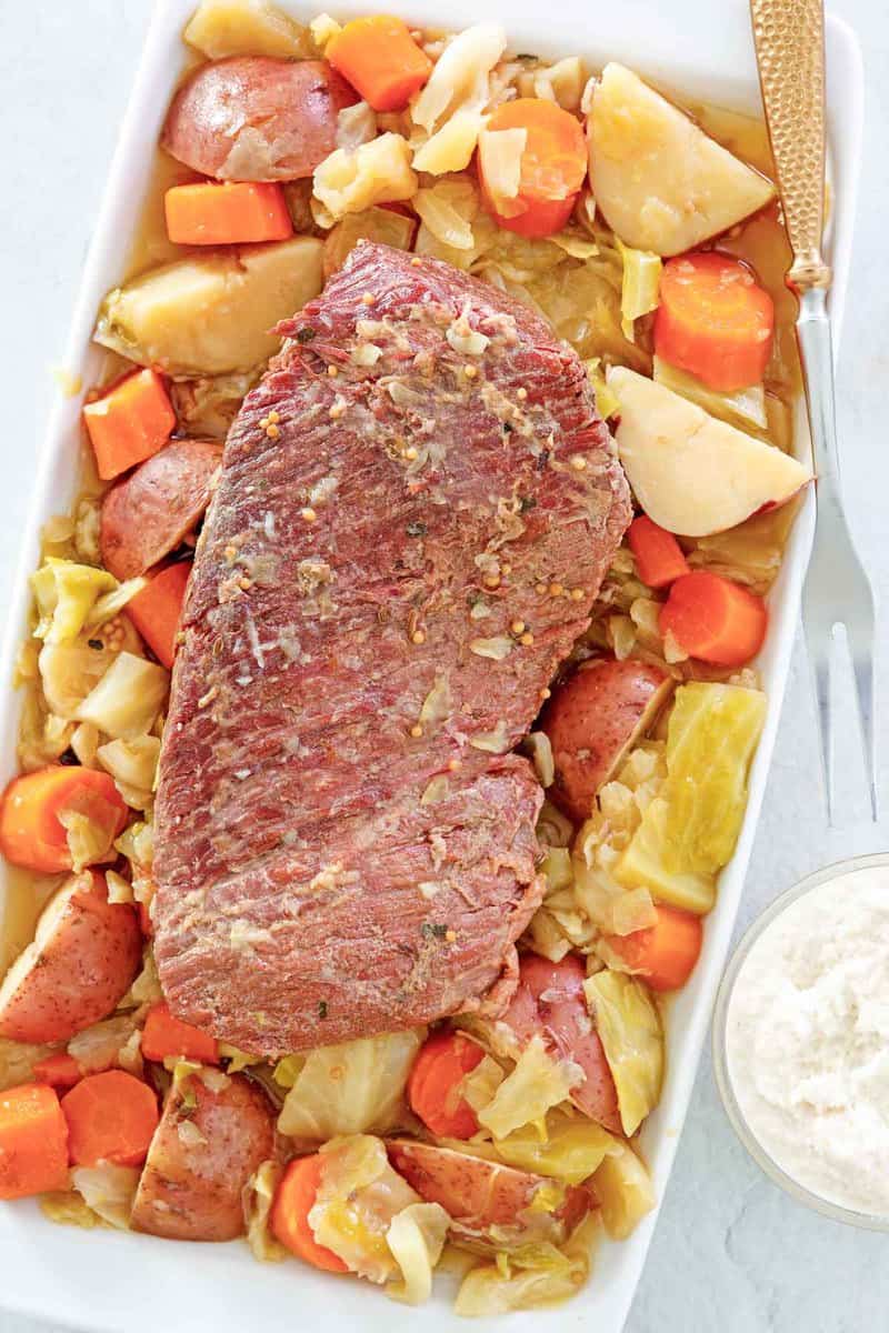 overhead view of instant pot corned beef and cabbage on a tray.