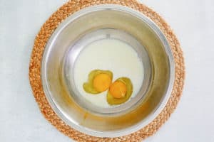 eggs and milk in a mixing bowl.