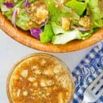 overhead view of copycat Outback blue cheese vinaigrette in a bowl and a salad.