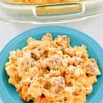 sausage mac and cheese casserole on a plate and in a baking dish.