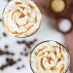 overhead view of two homemade Starbucks salted caramel latte drinks.