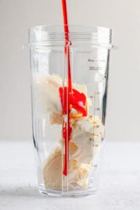 Wendy's strawberry frosty ingredients in a blender.