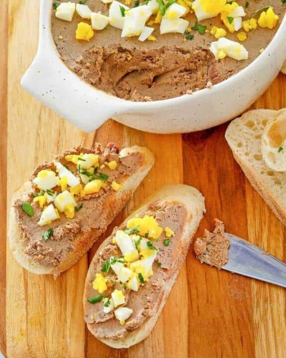 chicken liver pate on bread slices and in a dish.