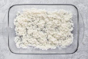 cooked rice in a baking dish.