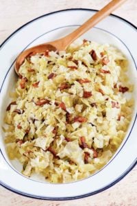 boiled cabbage with bacon on a serving platter.