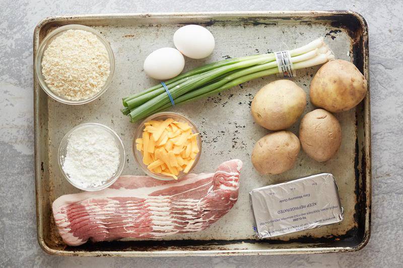 Cheesecake Factory loaded baked potato tots ingredients on a baking sheet.