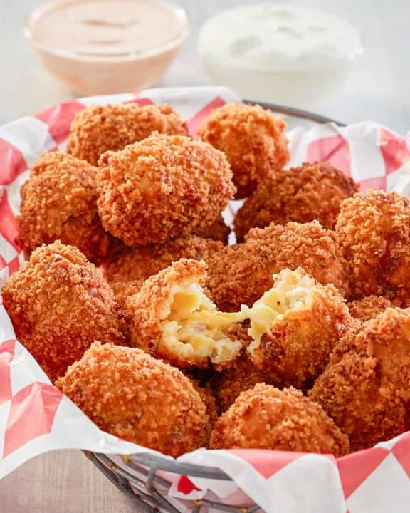 copycat Cheesecake Factory loaded baked potato tots in a basket.
