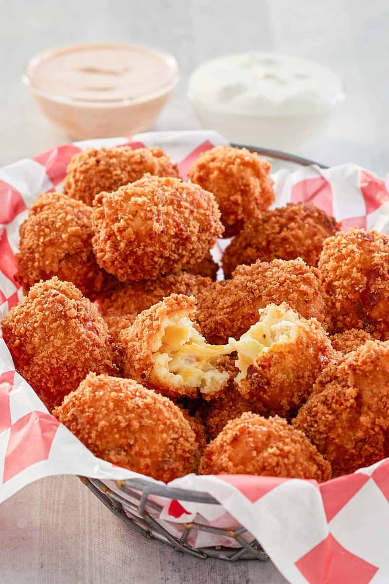 copycat Cheesecake Factory loaded baked potato tots in a basket.