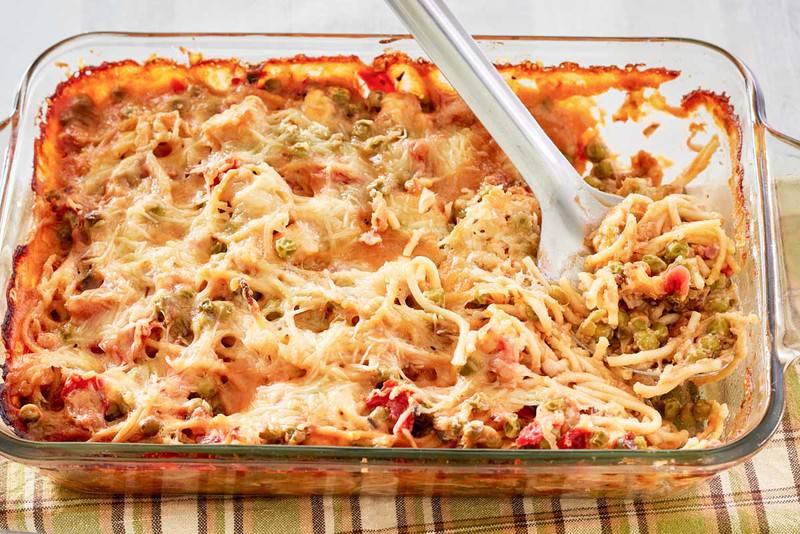 chicken spaghetti casserole in a glass baking dish.