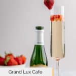 homemade grand lux cafe strawberry bellini and a bottle of champagne.
