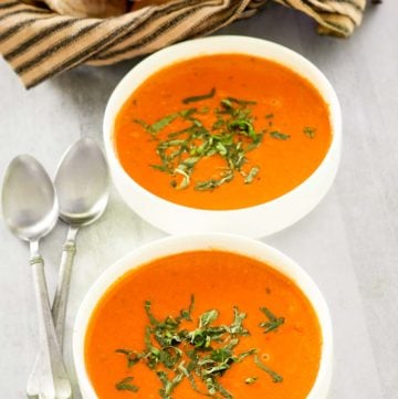 copycat La Madeleine tomato basil soup in two bowls.