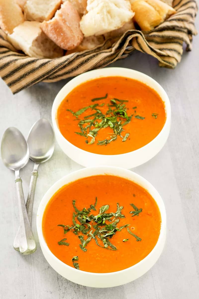 copycat La Madeleine tomato basil soup in two bowls.