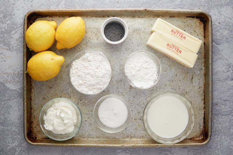 lemon poppy seed muffins ingredients on a baking sheet.
