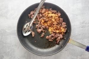 cooked ground beef and Mexican seasonings in a skillet.