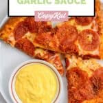 homemade Papa John's garlic sauce and pizza slices on a plate.