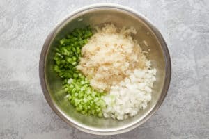 sauerkraut salad ingredients in a bowl.