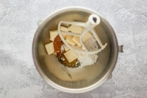 Texas Roadhouse butter ingredients and a mixer beater in a mixing bowl.