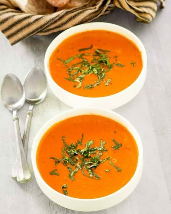 copycat La Madeleine tomato basil soup in two bowls.