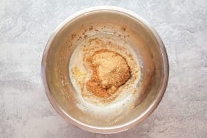 graham cracker crust ingredients in a mixing bowl.