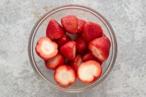 hulled strawberries in a bowl.