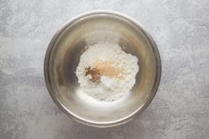 flour and seasonings for homemade potato wedges in a bowl.