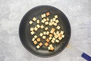 pound cake croutons in a skillet.