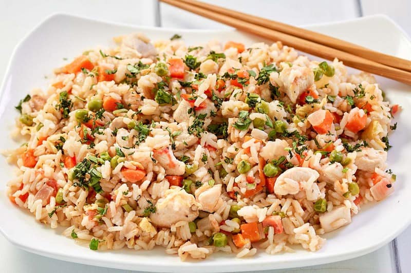 Thai chicken fried rice on a white serving platter.