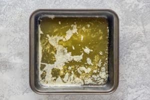 melted butter in a baking pan.