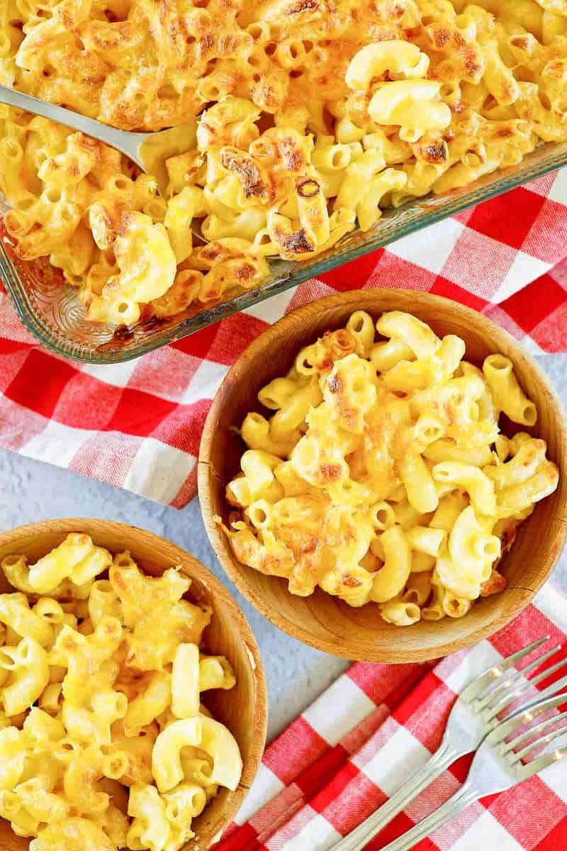overhead view of copycat Chick Fil A mac and cheese in a sultry dish and bowls.